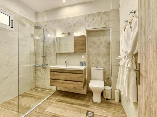 a bathroom with a toilet and a sink and a shower at Villa in Zakynthos with Private Pool & Beaches in Pigadhákia
