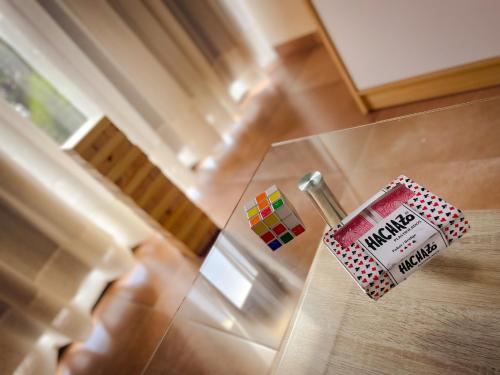 a glass table with a coffee cup on top of it at Andelka-Chumamaya Merlo San Luis in Merlo