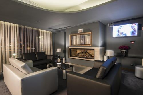 a living room with a couch and a fireplace at Vila Gale Collection Douro in Lamego