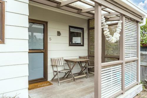 a patio with a table and a pergola at Greenhaven with wi-fi in Taupo