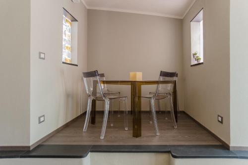 a dining room with a table and two chairs at La Pulce Argentata in Sestri Levante