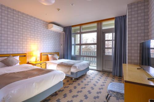 Ein Bett oder Betten in einem Zimmer der Unterkunft TAOYA Nikko Kirifuri