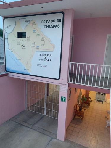 a map of china on the side of a building at Hotel Jacaranda in Tuxtla Gutiérrez