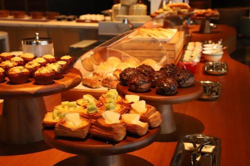 a display of different types of pastries on three plates at The Westin Yantai in Yantai