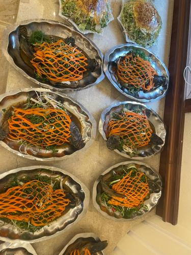 a group of four bowls with carrots in them at Khách sạn Đại Dương Diễn Châu - Nghệ An in Diễn Châu