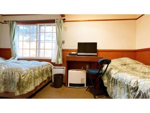 מיטה או מיטות בחדר ב-Hakuba Pension Meteor - Vacation STAY 63331v