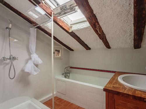 a bathroom with a shower and a sink and a bath tub at Charmant T3 sous les toits, centre historique de St-Jean-de-Luz, proche plage et commerces - FR-1-4-681 in Saint-Jean-de-Luz