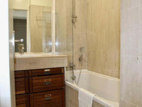 a bathroom with a tub and a sink and a shower at Appartement Villeneuve-Loubet, 2 pièces, 4 personnes - FR-1-252A-113 in Villeneuve-Loubet