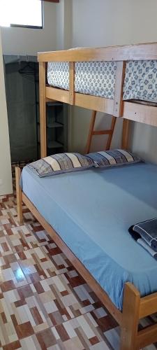 Кровать или кровати в номере Travelers' House Casa Hospedaje