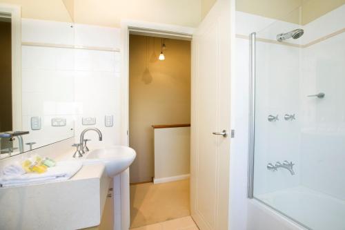 a bathroom with a sink and a shower at Blueys Retreat in Blueys Beach