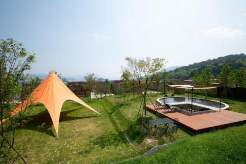 a large kite sitting on top of a yard at Marinetopia The Suite in Miyazu