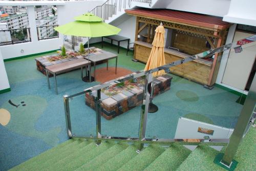 an overhead view of a room with a table and an umbrella at Beverly Hills Suite Residence in Geoje 