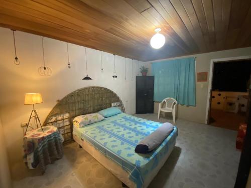 a bedroom with a large bed in a room at Matilda Ec in Vilcabamba