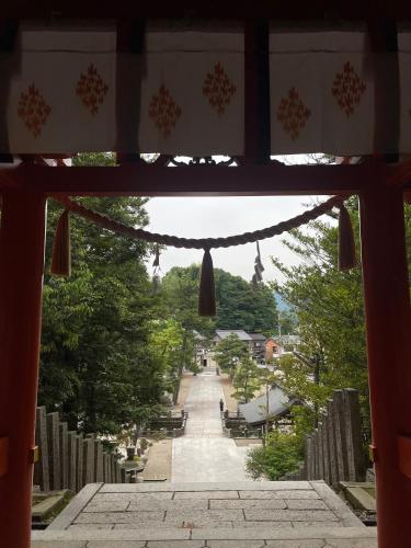 a view from an archway of a walkway at Marinetopia The Suite in Miyazu