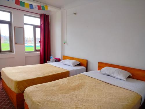 Postel nebo postele na pokoji v ubytování COMMUNITY HOLIDAY INN