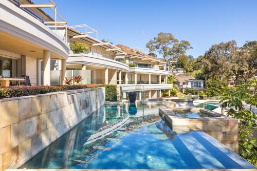 an image of a swimming pool in a house at Amarna Luxury Beach Resort in Nelson Bay