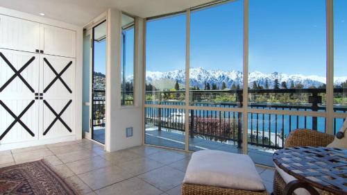a balcony with a view of the mountains at The Waterfront in Queenstown