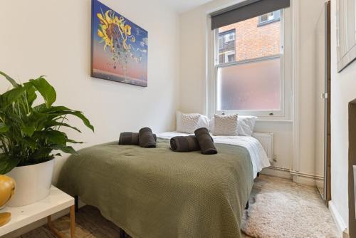 Katil atau katil-katil dalam bilik di Heart of London: 3 Bed near Oxford St and subway