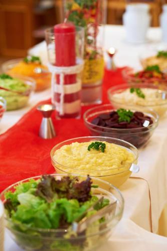 a table topped with bowls of food on a table at Gasthof Gigl in Neustadt an der Donau