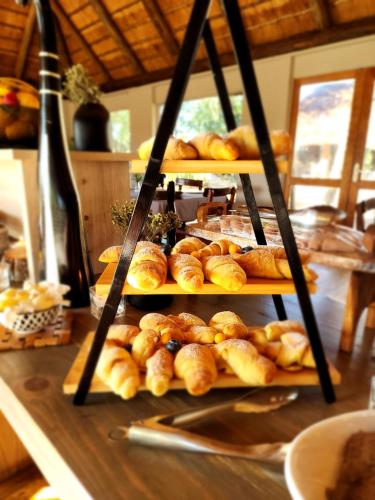 a display of breads and pastries on a table at Karongwe - River Safari Lodge in Hoedspruit