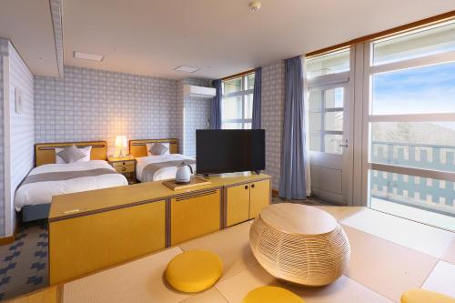 Ein Bett oder Betten in einem Zimmer der Unterkunft TAOYA Nikko Kirifuri