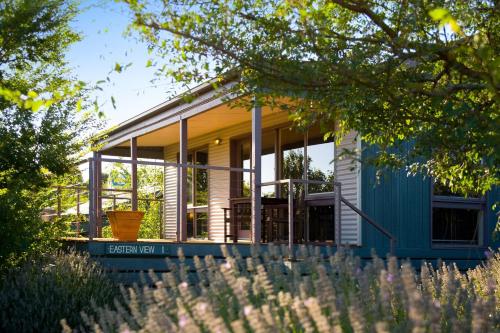 a house with a blue and white facade at Eastern View Studio in Daylesford
