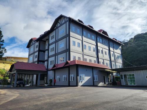 a large building with a lot of windows at Fathers Guesthouse Age 7 years old and above only in Tanah Rata