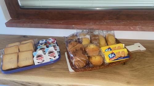 a basket of bread and other food on a table at Villa Romina in Selva di Fasano