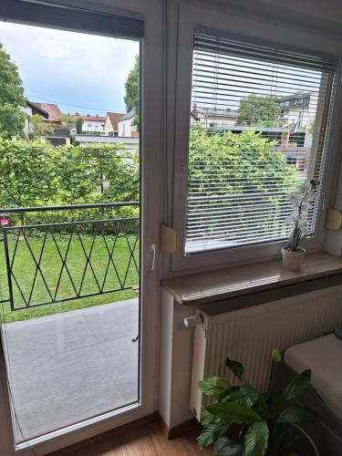 a door to a balcony with a view at Guesthouse Flower in Ljubljana