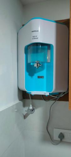 a computer monitor sitting on top of a table at Luxurious Apartment with a pool and gym near Trivandrum railway station in Trivandrum