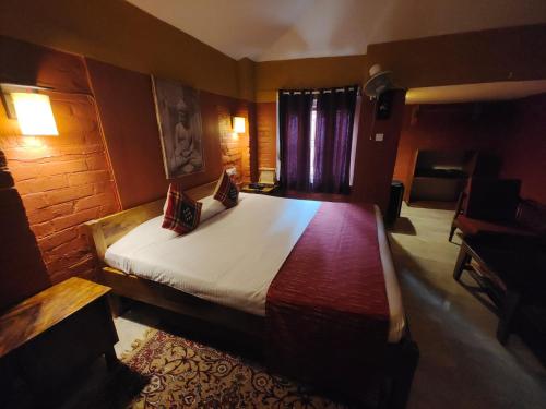 a bedroom with a large bed in a room at Wild Dunes Konark in Bālighāi