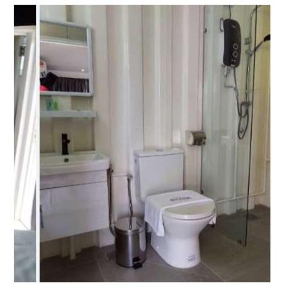 a bathroom with a toilet and a sink at Solesor Kampong Beach Resort in Port Dickson