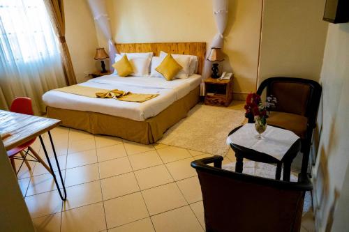 Ένα ή περισσότερα κρεβάτια σε δωμάτιο στο Acacia Hotel Mbarara