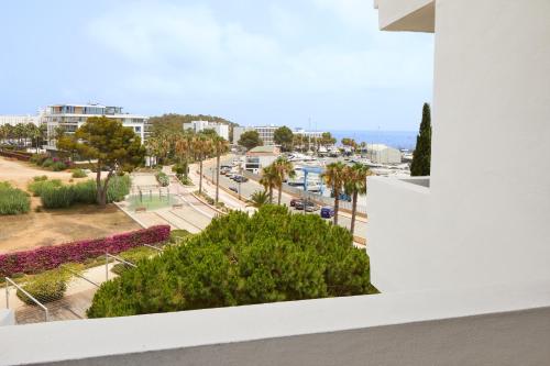 a view of a city street from a building at Hotel Tres Torres in Santa Eularia des Riu