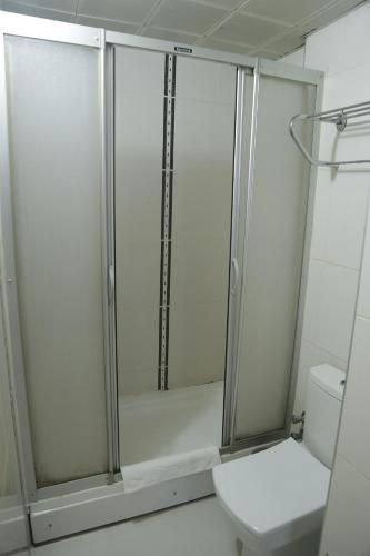 a bathroom with a shower and a toilet at Grand Zara Hotel in Kayseri