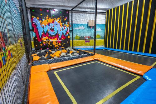 an indoor trampoline park with an inflatable at בקתות עץ מעל העננים - אירוח דרוזי - בקתות כפריות עם נוף מהמם ובריכה משותפת in Bet Dagan