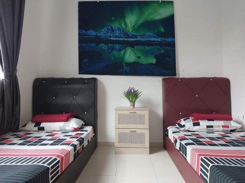 Postelja oz. postelje v sobi nastanitve 3 airconditioned bedroom in Muar Town