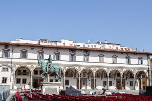 a large building with a statue in front of it at David Sweet Suite in Florence