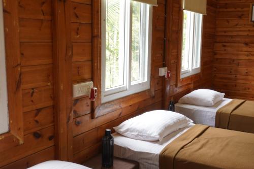 Postel nebo postele na pokoji v ubytování Tranquil Beach Resort