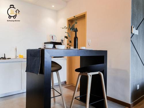 a blue counter in a kitchen with stools at 1 min to Seaview & Sunrise Heart of Kuantan in Kuantan