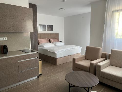 Ένα ή περισσότερα κρεβάτια σε δωμάτιο στο Madamik apartments