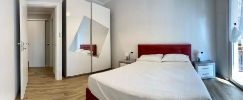מיטה או מיטות בחדר ב-CASA BEATRICE, trilocale Nuovo completamente arredato, compreso posto auto
