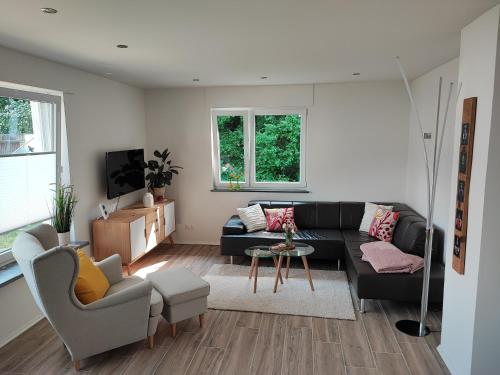 a living room with a couch and a table at Muhrbach in Weier