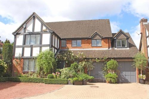 a brick house with a garage at Large & Spacious 5 Bedroom, 3.5 Bathroom House in Southampton