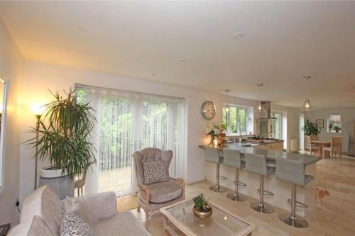 a living room with a couch and a table at Large & Spacious 5 Bedroom, 3.5 Bathroom House in Southampton