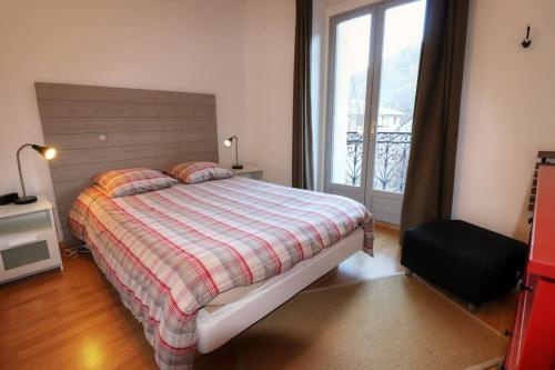 Кровать или кровати в номере Bel appartement Bagnère de Luchon 4 personnes