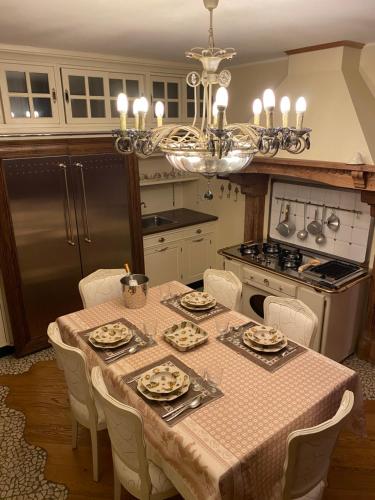 a kitchen with a table with dishes on it at Villa Marzia in Lanzo dʼIntelvi