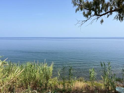 a view of the ocean from a bluff at Casello 79 Rais in Finale