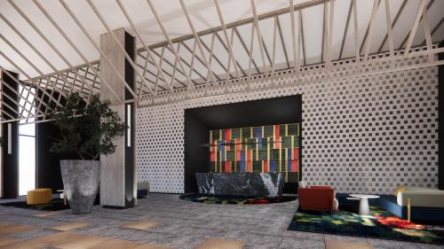 a lobby with a book shelf on a brick wall at Aston Serang Hotel & Convention Center in Serang
