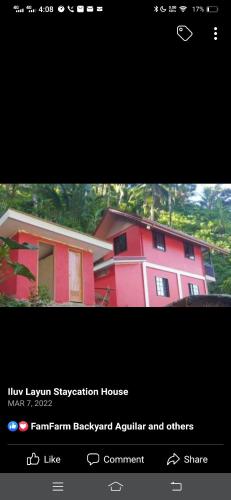 ein Bild eines roten Hauses mit den Worten "neues Luxusaufsichtshaus" in der Unterkunft Iluv layun in Real